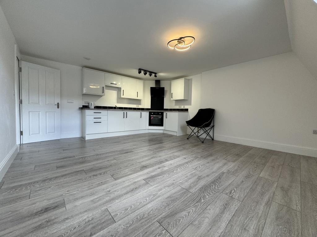 Lot: 155 - TWO-BEDROOM TOP FLOOR FLAT IN CENTRAL LOCATION - Living room/kitchen and dining room